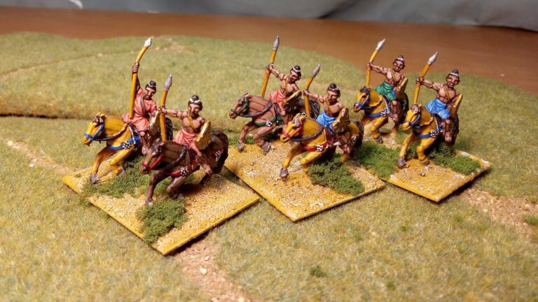 Historical cavalry miniatures on scenic textured bases with grass and terrain details