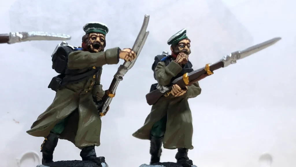 Two painted 28mm historical infantry miniatures with prominent beards and mustaches, demonstrating how facial hair adds individual character to soldiers.