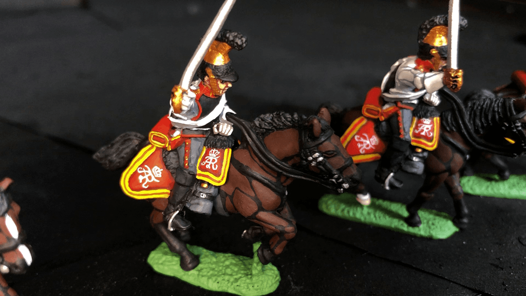 Napoleonic cavalry horses with hand-painted heraldic saddlecloths